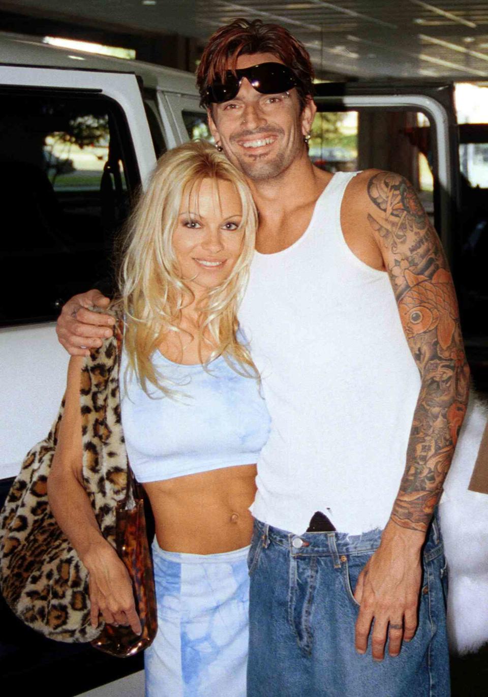 Pamela Anderson of BAYWATCH fame and Tommy Lee of Motley Crue fame as they leave Tampa International Airport in Tampa, Florida