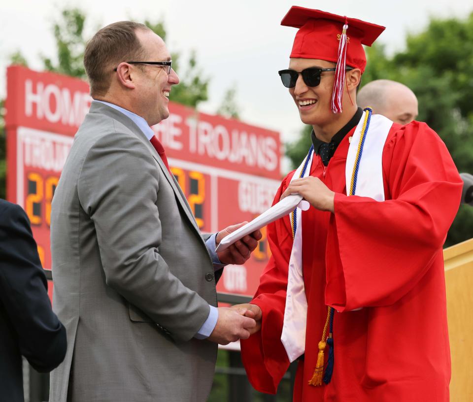 Bridgewater-Raynham Regional High School Class President Michael Rubbo receives his diploma from Derek Swenson, superintendent of schools, during graduation exercises on Friday, June 3, 2022.