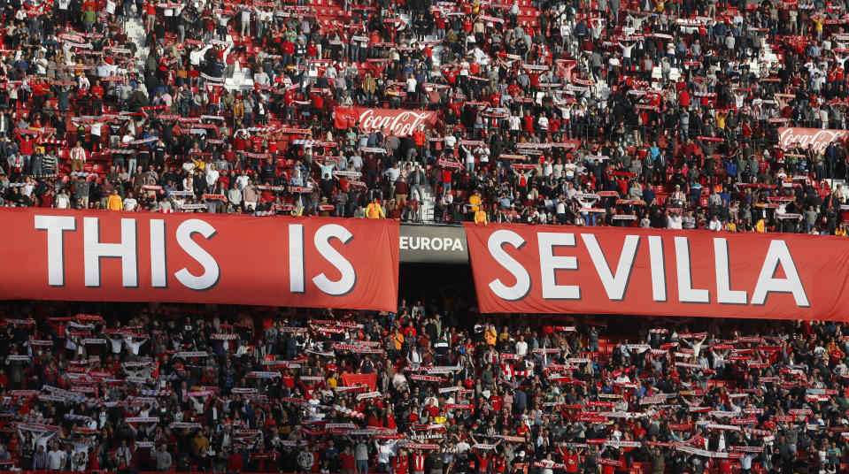 Sevilla fans support their team during the Europa League round of 32 second leg soccer match between Sevilla and Lazio at the Sanchez Pizjuan stadium, in Seville, Spain, Wednesday, Feb. 20, 2019. (AP Photo/Miguel Morenatti)