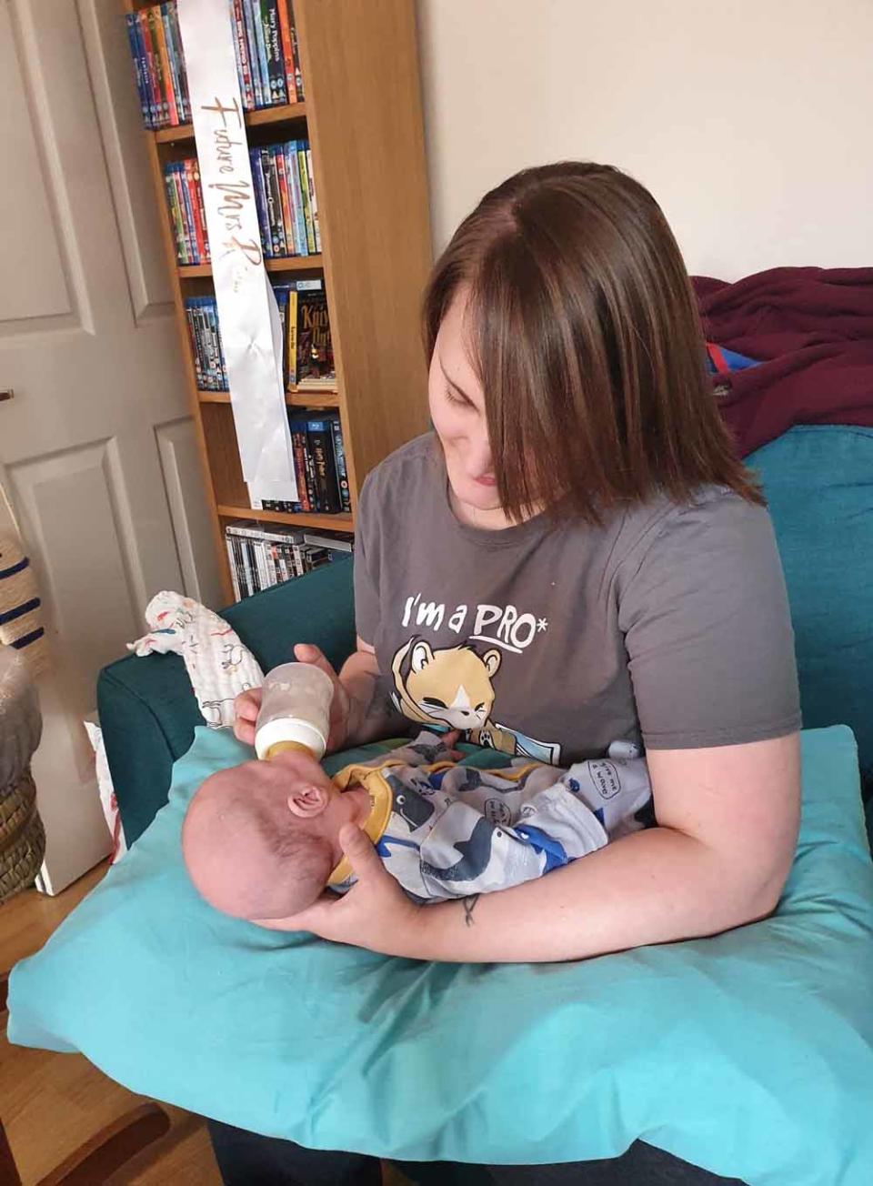 Louise feeding Oscar when he came home in August this year (Collect/PA Real Life).