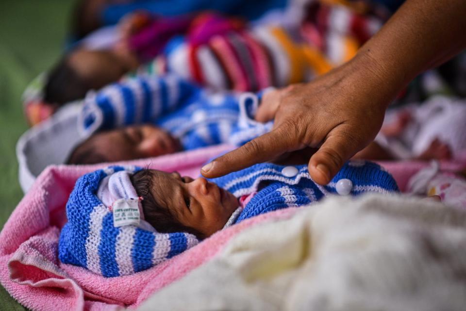 Newborn babies rest inside a government maternity hospital in Chennai, India (EPA)