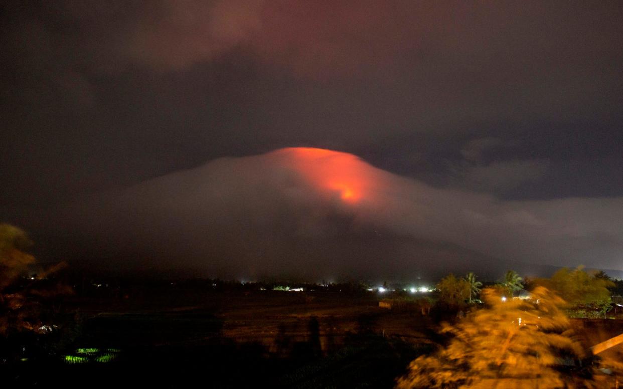 The Philippines' most active volcano rumbled back to life Sunday with lava rising to its crater - Earl Recamunda