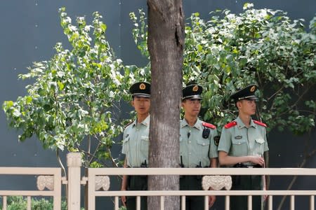 Paramilitary officers keep watch in Tiananmen Square in Beijing