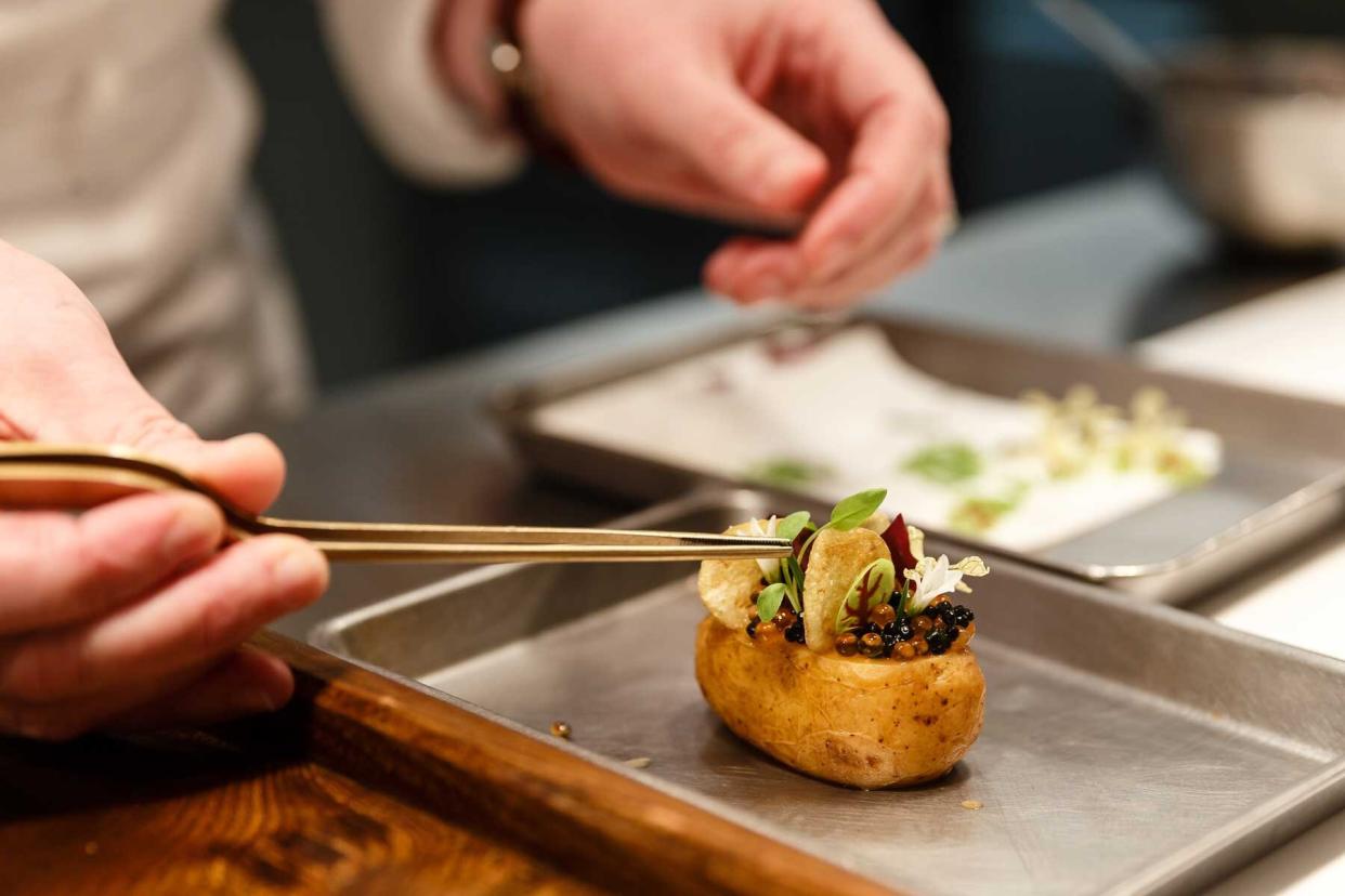 Clare Smyth, chef, prepares a dish of 'Potato and Roe' at the Core by Clare Smyth restaurant in the Notting Hill district of London, U.K., on Wednesday, Jan. 16, 2019.