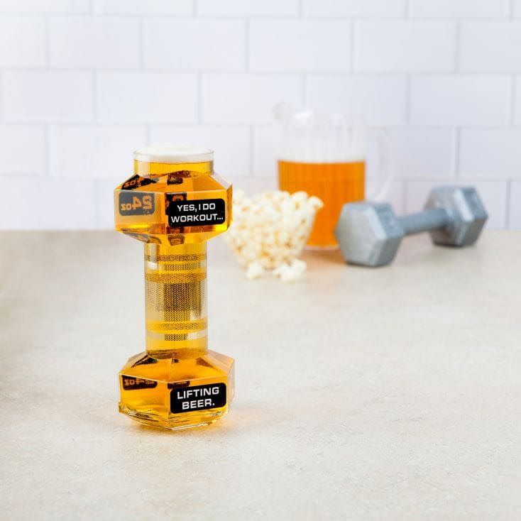 <p>This is certainly a novelty beer glass! Designed as though a dumbbell! Perfect for all beer drinking gym-junkies.</p><p><a class="link " href="https://go.redirectingat.com?id=127X1599956&url=https%3A%2F%2Fwww.gettingpersonal.co.uk%2Fgifts%2Flifting-beer-glass.htm%3Fsplit%3DFLASH%26opti_ca%3D1481825983%26opti_ag%3D56367295846%26opti_ad%3D284614382521%26opti_key%3Daud-521087511077%253Apla-781427333648%26gclid%3DCjwKCAjwq4fsBRBnEiwANTahcLEfywtQdgSPahd0QTsqSzWLg1vKwrSWDTJyVT9UvENmPEX7IcaTCxoC26cQAvD_BwE&sref=https%3A%2F%2Fwww.delish.com%2Fuk%2Fcocktails-drinks%2Fg29855274%2Falcoholic-gift-guide%2F" rel="nofollow noopener" target="_blank" data-ylk="slk:BUY NOW;elm:context_link;itc:0;sec:content-canvas">BUY NOW</a> <strong>£14.99, Getting Personal</strong></p>