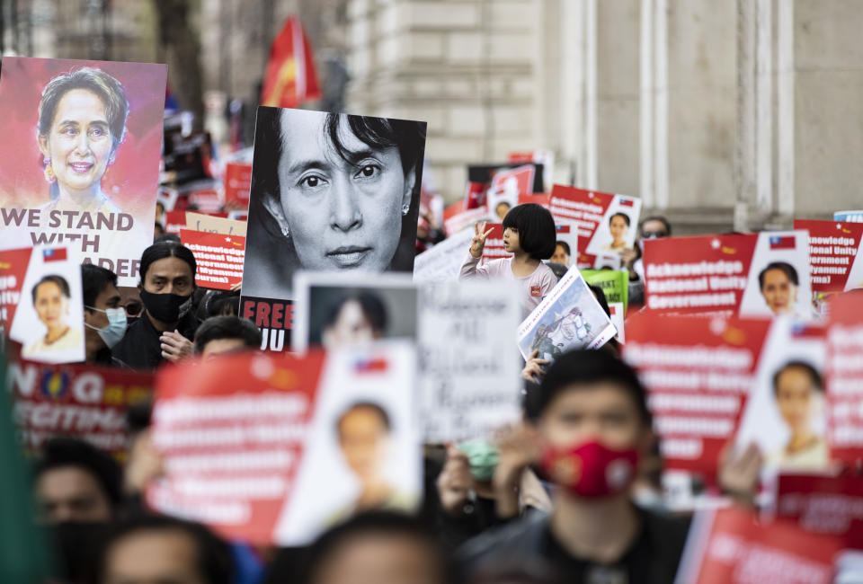 <p>Protesters hold placards during the global Myanmar Spring Revolution as they match to Trafalgar Square in London. 18 countries, 37 cities and ground activists joined hand in hand showing solidarity with democratic protesters in Myanmar during The global Myanmar Spring Revolution. Since February 1, 2021, following a general election which was won by Aung San Suu Kyi�s National League for Democracy (NLD) party, the military seized control and has declared a year-long state of emergency. Hundreds of people, including children, have been killed. Many people been detained including the elected leader Aung San Suu Kyi and members of her NLD party. (Photo by May James / SOPA Images/Sipa USA)</p>
