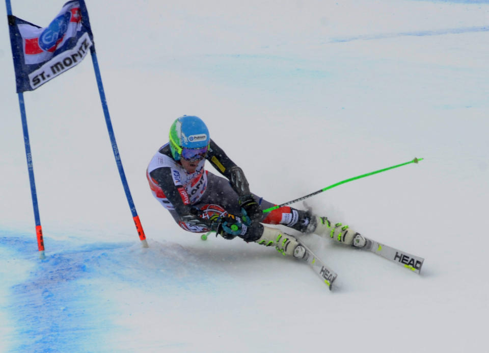 Usa's Ted Ligety of the United States speed down the course during the first run of an alpine ski men's World Cup giant slalom in St. Moritz, , Switzerland, Sunday, Feb. 2, 2014. (AP Photo/Pier Marco Tacca)