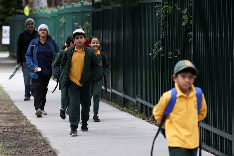 Children return to campus for the first day of New South Wales public schools fully re-opening in Sydney