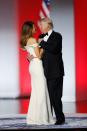 <p>Donald Trump and his wife, Melania Trump, dance at the inaugural ball honoring his appointment as the 45th President of the United States. For the evening's events, the First Lady wore an off-the-shoulder white gown with a red sash, designed by Carolina Herrera's former creative director, Hervé Pierre. </p>