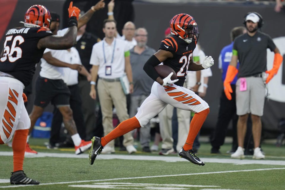 Cincinnati Bengals safety Tycen Anderson returns an intercepted pass for a touchdown during the first half of a preseason NFL football game against the Green Bay Packers on Friday, Aug. 11, 2023, in Cincinnati. (AP Photo/Michael Conroy)