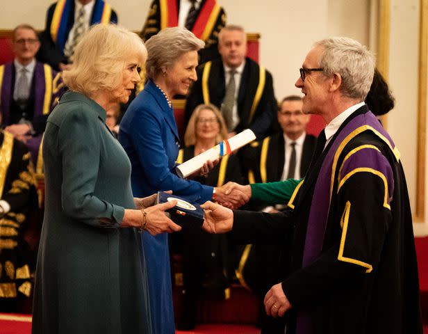 <p>Aaron Chown-WPA Pool/Getty</p> Queen Camilla presents the Queen's Anniversary Prize to representatives from the University of the Arts London, during an event to present the Queen's Anniversary Prizes for Higher and Further Education, at Buckingham Palace on February 22, 2024.