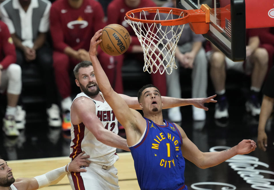 Denver Nuggets forward Michael Porter Jr. (1) drives to the basket during the second half of Game 3 of the NBA Finals basketball game against the Miami Heat, Wednesday, June 7, 2023, in Miami. (AP Photo/Rebecca Blackwell)