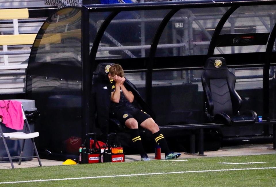 Columbus Crew midfielder Aidan Morris sits on the sideline after injuring his knee in the first half of the second leg against Real Esteli FC.