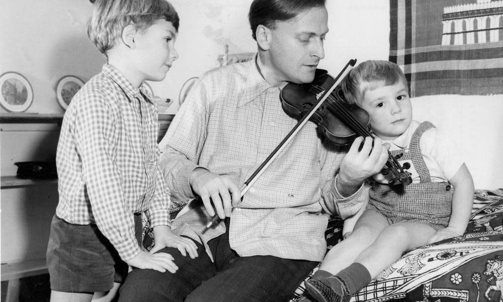 Yehudi Menuhin in 1954 with his sons. He made his first public appearance aged seven as solo violinist with the San Francisco Symphony Orchestra.