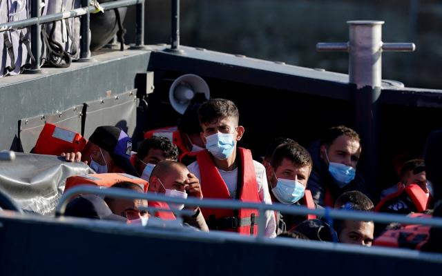 Migrants in a small boat - Gareth Fuller/PA