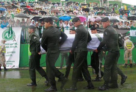 The coffin of one of the victims of the plane crash in Colombia arrives at the Arena Conda stadium in Chapeco, Brazil, December 3, 2016. REUTERS/Diego Vara