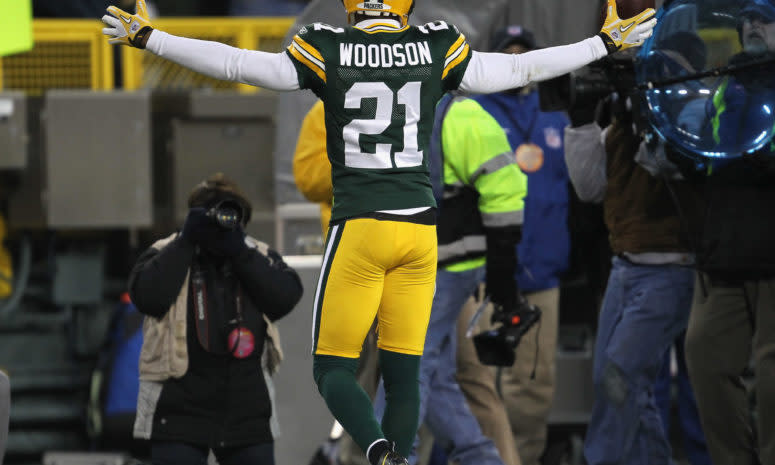 Packers DB Charles Woodson celebrates a pick-6.