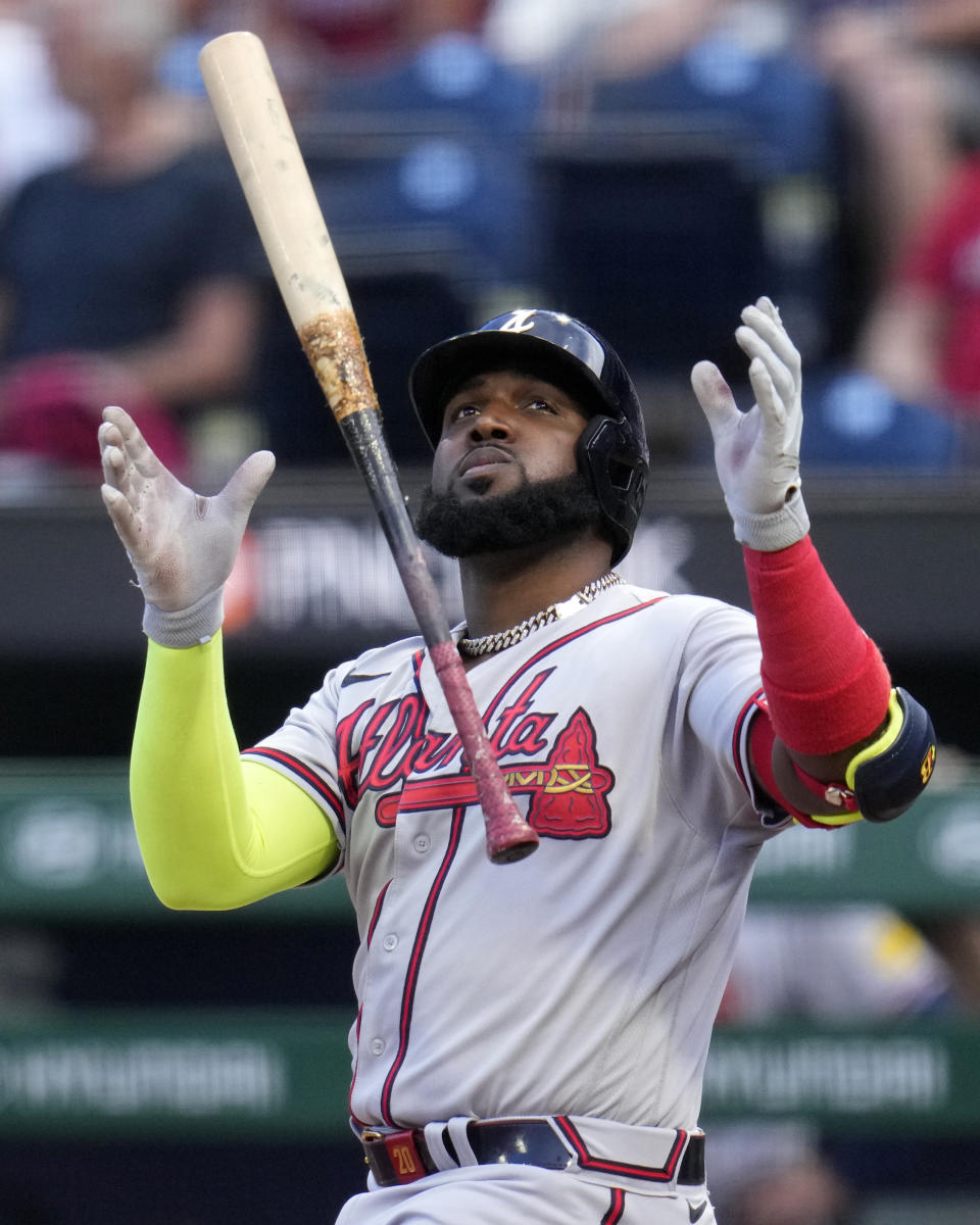 Atlanta Braves' Marcell Ozuna tosses his bat as he strikes out on a pitch from Pittsburgh Pirates starting pitcher Osvaldo Bido during the second inning of a baseball game in Pittsburgh, Monday, Aug. 7, 2023. (AP Photo/Gene J. Puskar)
