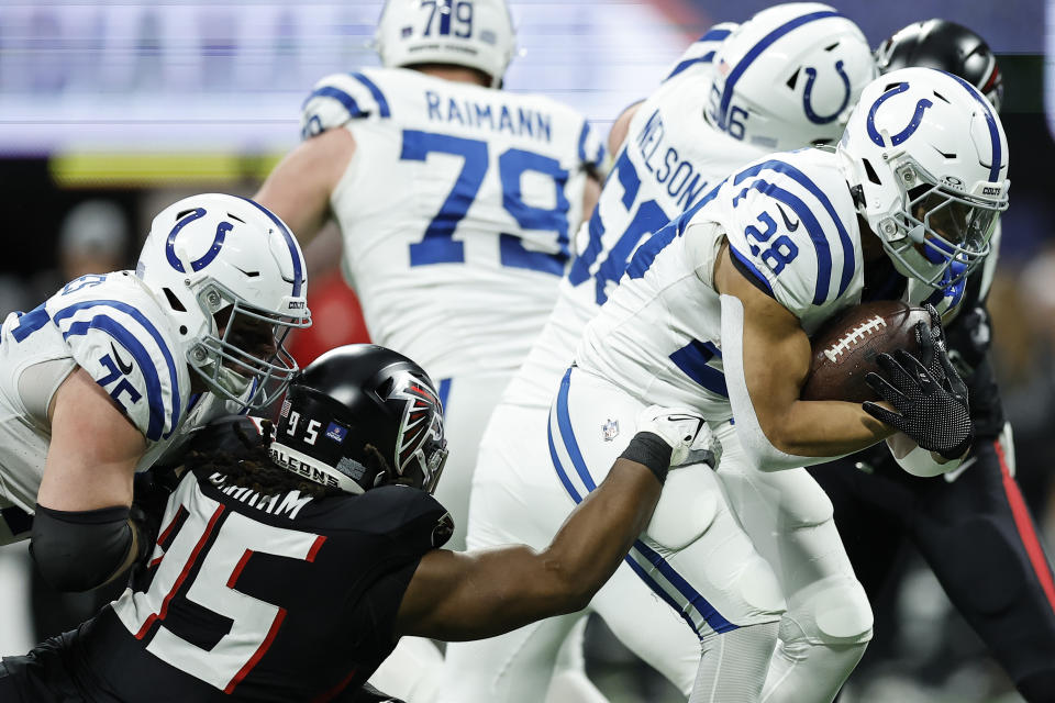 Indianapolis Colts running back Jonathan Taylor (28) heads toward the end zone for a touchdown against the Atlanta Falcons during the first half of an NFL football game, Sunday, Dec. 24, 2023, in Atlanta. (AP Photo/Alex Slitz)