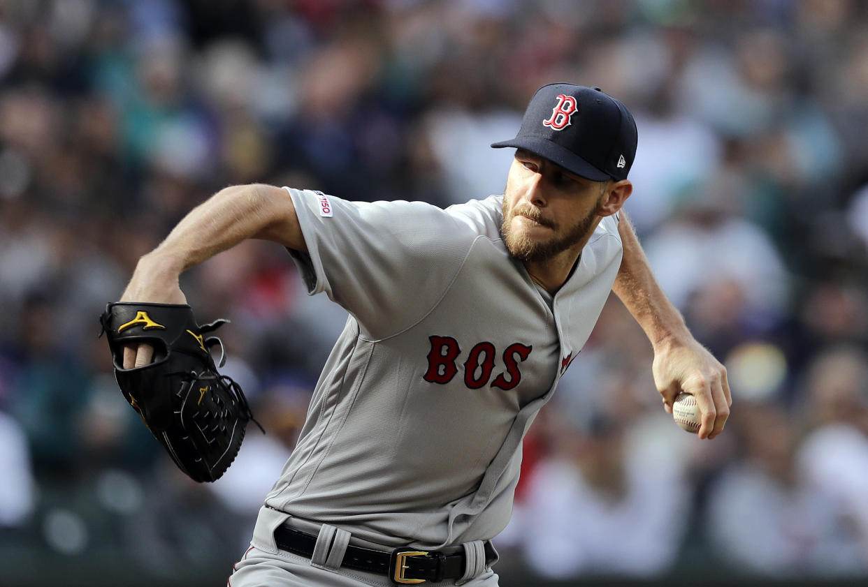 Boston Red Sox ace Chris Sale was roughed up by the Seattle Mariners in 2019 debut. Is his lower velocity and lack of command a cause for concern? (AP Photo/Elaine Thompson)