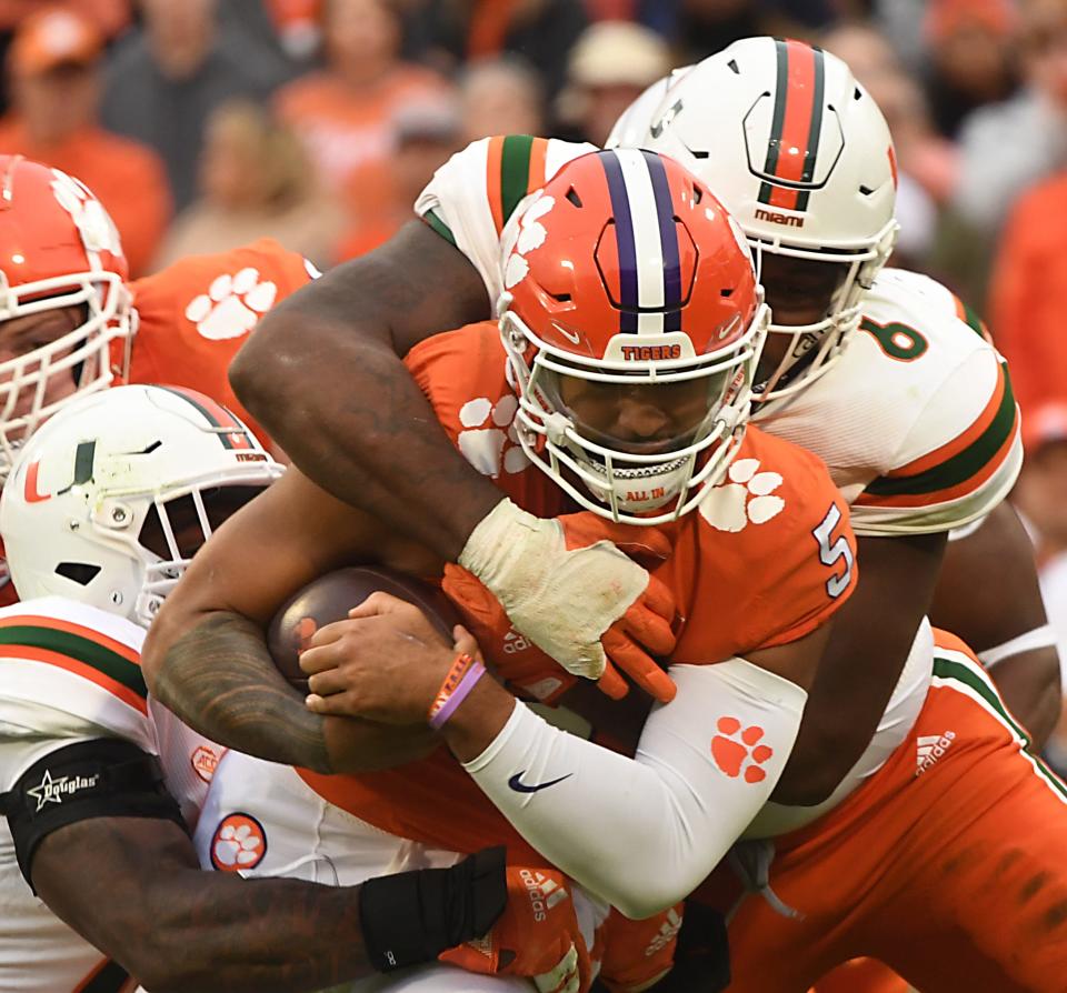 Action during the game between Clemson and Miami at Memorial Stadium in Clemson, South Carolina Saturday, Nov. 19, 2022.   Clemson quarterback D.J. Uiagalelei (5) on a running play. 