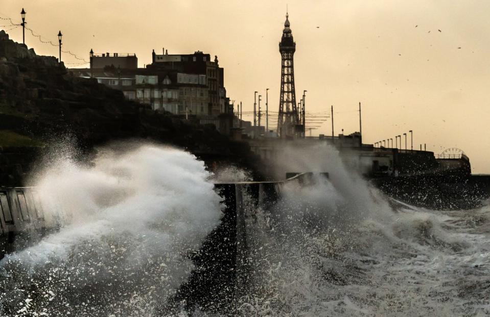 Waves break on the sea front in Blackpool (PA)