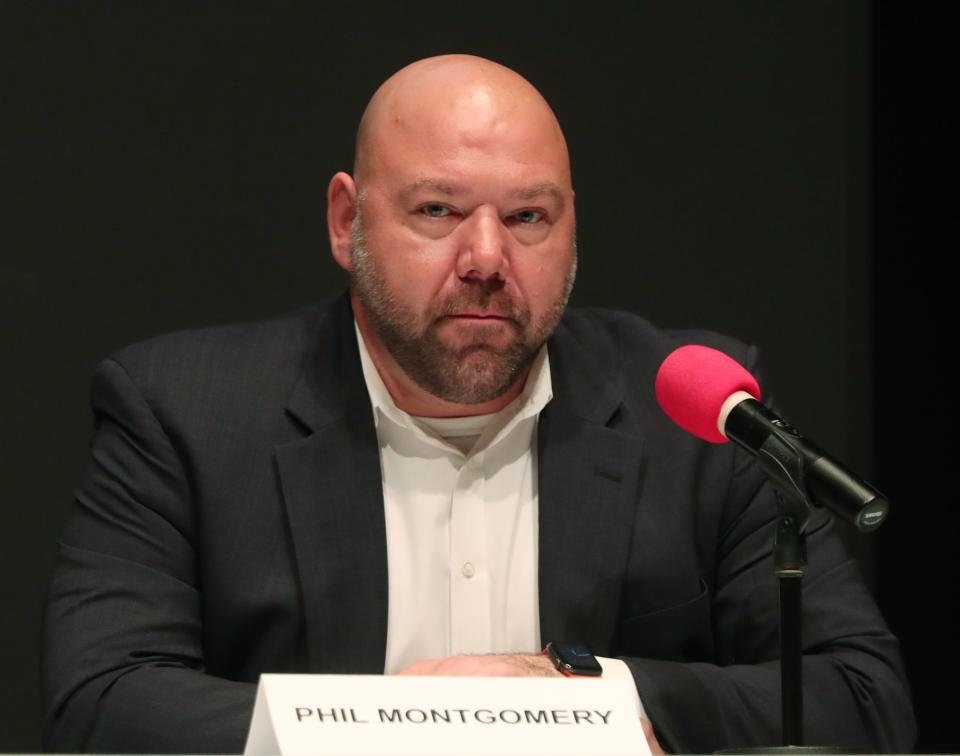 School Board candidate Phil Montgomery answers a question during the Akron City School Board Candidate Forum at the Akron-Summit County Library in Akron.