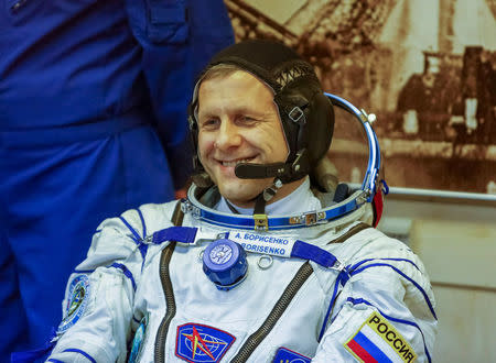 The International Space Station (ISS) crew member Andrey Borisenko of Russia smiles after donning a space suit at the Baikonur cosmodrome, Kazakhstan October 19, 2016. REUTERS/Shamil Zhumatov