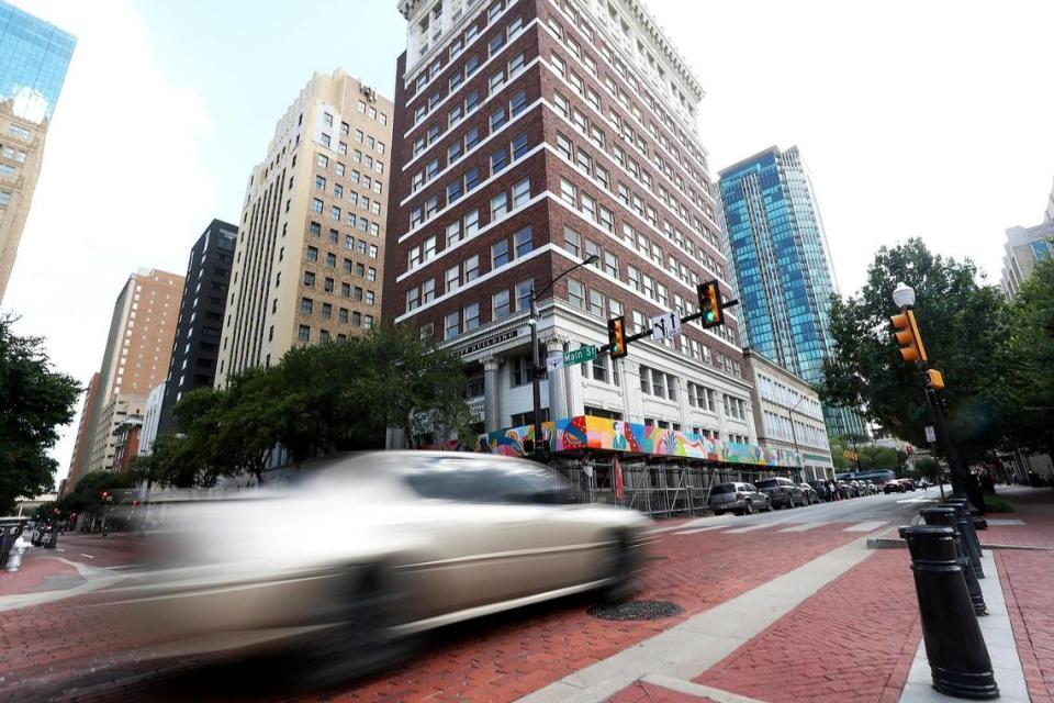 A car drives down West 4th Street in downtown Fort Worth’s Sundance Square area on Thursday, July 15, 2021.