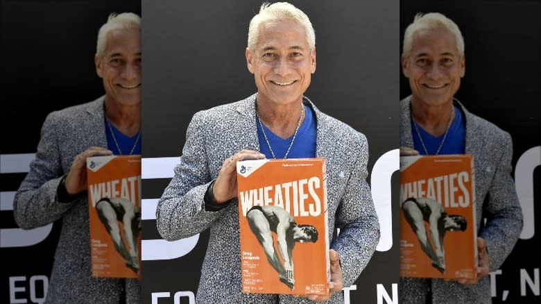 Greg Louganis with Wheaties box