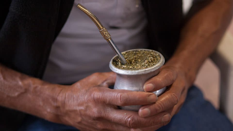 A rural worker holds an infusion of 'mate' in the northeastern Argentine province of Misiones on August 27, 2015. - Ricardo Ceppi/Getty Images/File