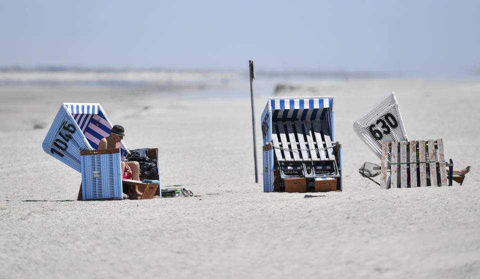 In this photo taken on Wednesday, May 15, 2019, tourists enjoy the sun in beach chairs on the car-free environmental island of Langeoog in the North Sea, Germany. Concerns about climate change have prompted mass protests across Europe for the past year and are expected to draw tens of thousands onto the streets again Friday, May 24. For the first time, the issue is predicted to have a significant impact on this week’s elections for the European Parliament. (AP Photo/Martin Meissner)