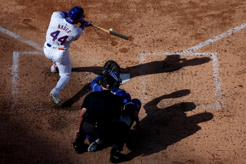 New York Mets center fielder Harrison Bader (44) follows through on an RBI infield single against the Kansas City Royals during the eighth inning on April 14, 2024, at Citi Field.