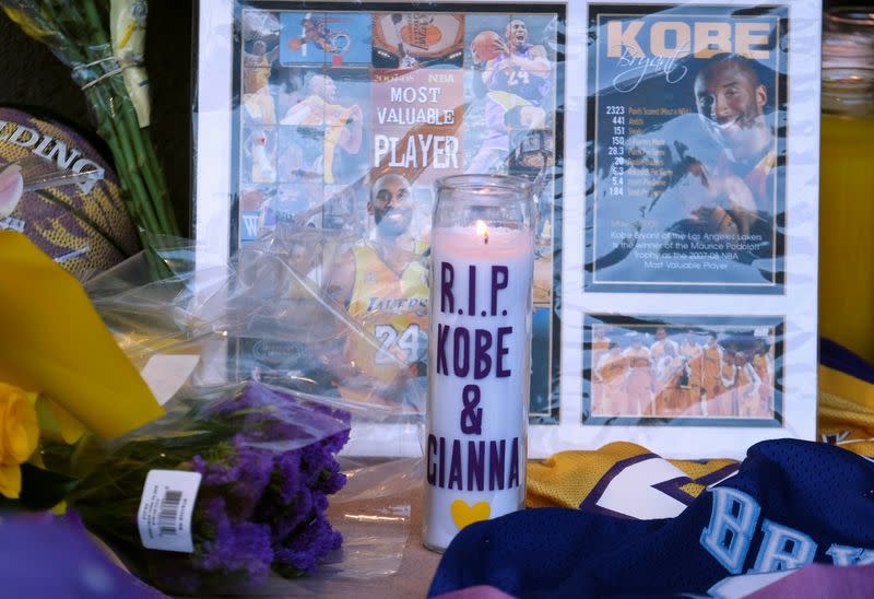 Flowers, photos and messages are placed at a makeshift memorial for former NBA player Kobe Bryant outside of the Mamba Sports Academy in Thousand Oaks