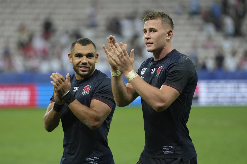 England's Joe Marchant, left and England's Freddie Steward applaud the fan after the end of the Rugby World Cup Pool D match between England and Japan in the Stade de Nice, in Nice, France Sunday, Sept. 17, 2023. England won the game 34-12. (AP Photo/Pavel Golovkin)