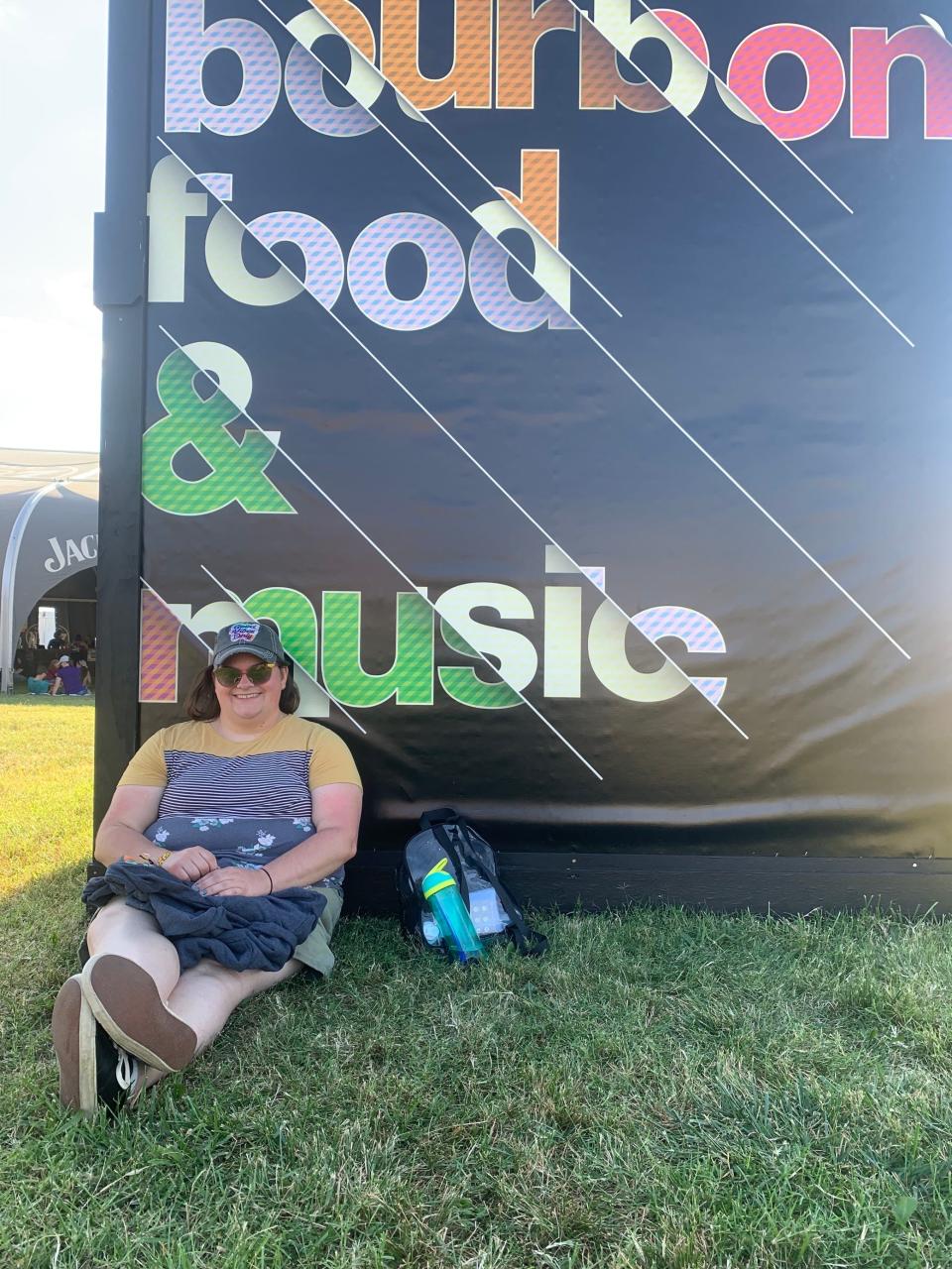 Regina Henderson sat Thursday afternoon in the shade of a poster tower, fresh off listening to one of her bucket list bands, Drew Holcomb & The Neighbors.