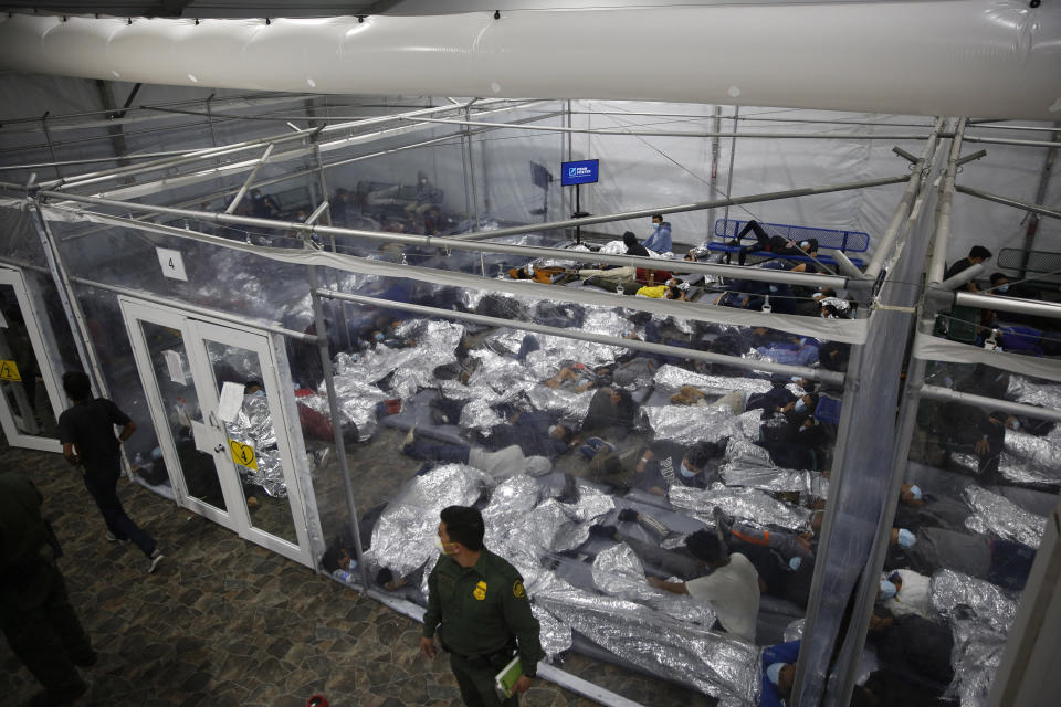 Young minors lie inside a pod at the Donna Department of Homeland Security holding facility, the main detention center for unaccompanied children in the Rio Grande Valley run by the US Customs and Border Protection, (CBP), in Donna, Texas on March 30, 2021. (Dario Lopez-Mills/AFP via Getty Images)