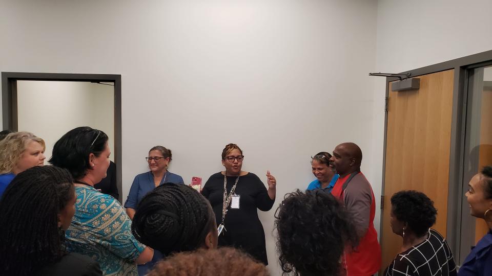 Cumberland HealthNET Director Shelley Hudson, center, gives a tour of the Day Resource Center to people with agencies and organizations that deal with the homeless population. A ribbon-cutting for the center off U.S. 301 downtown was held on Monday morning Aug. 21, 2023.