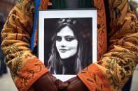 <p>A protestor holds an image of Amini in Toulouse, France, on Dec. 3. </p>