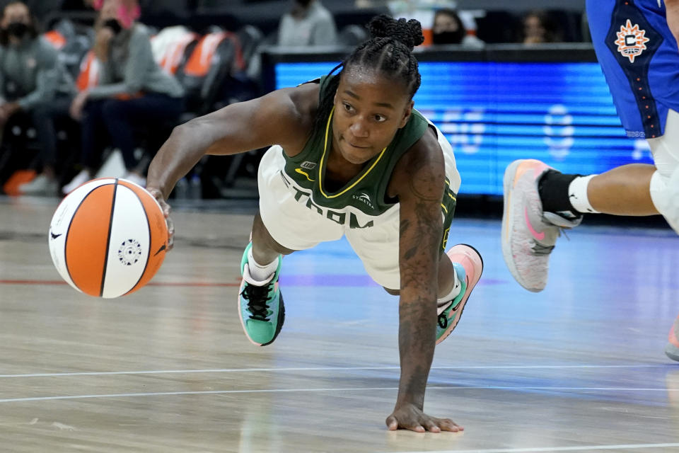 Seattle Storm guard Jewell Loyd passes the ball during the first half against the Connecticut Sun in the Commissioner's Cup WNBA basketball game Thursday, Aug. 12, 2021, in Phoenix. (AP Photo/Matt York)