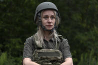Servicewoman Liudmyla Rochacheva looks on as she attends a combat medic course training in Kyiv, Ukraine, Monday, July 11, 2022. Every day, up to 100 people attend the training. (AP Photo/Vasilisa Stepanenko)
