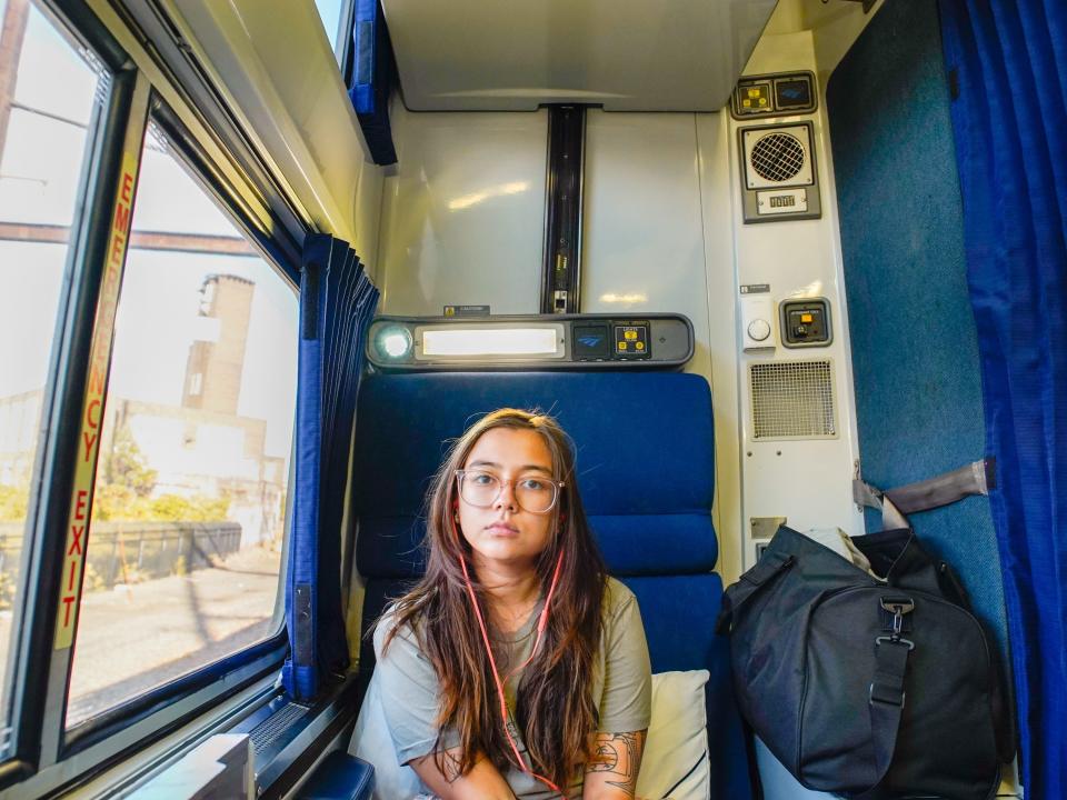 The author sits on a train to Miami