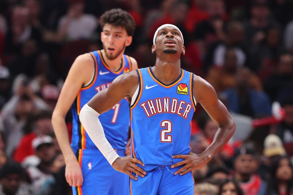 Chet Holmgren #7 and Shai Gilgeous-Alexander #2 of the Oklahoma City Thunder look on against the Chicago Bulls during the first half at the United Center on October 25, 2023 in Chicago, Illinois.