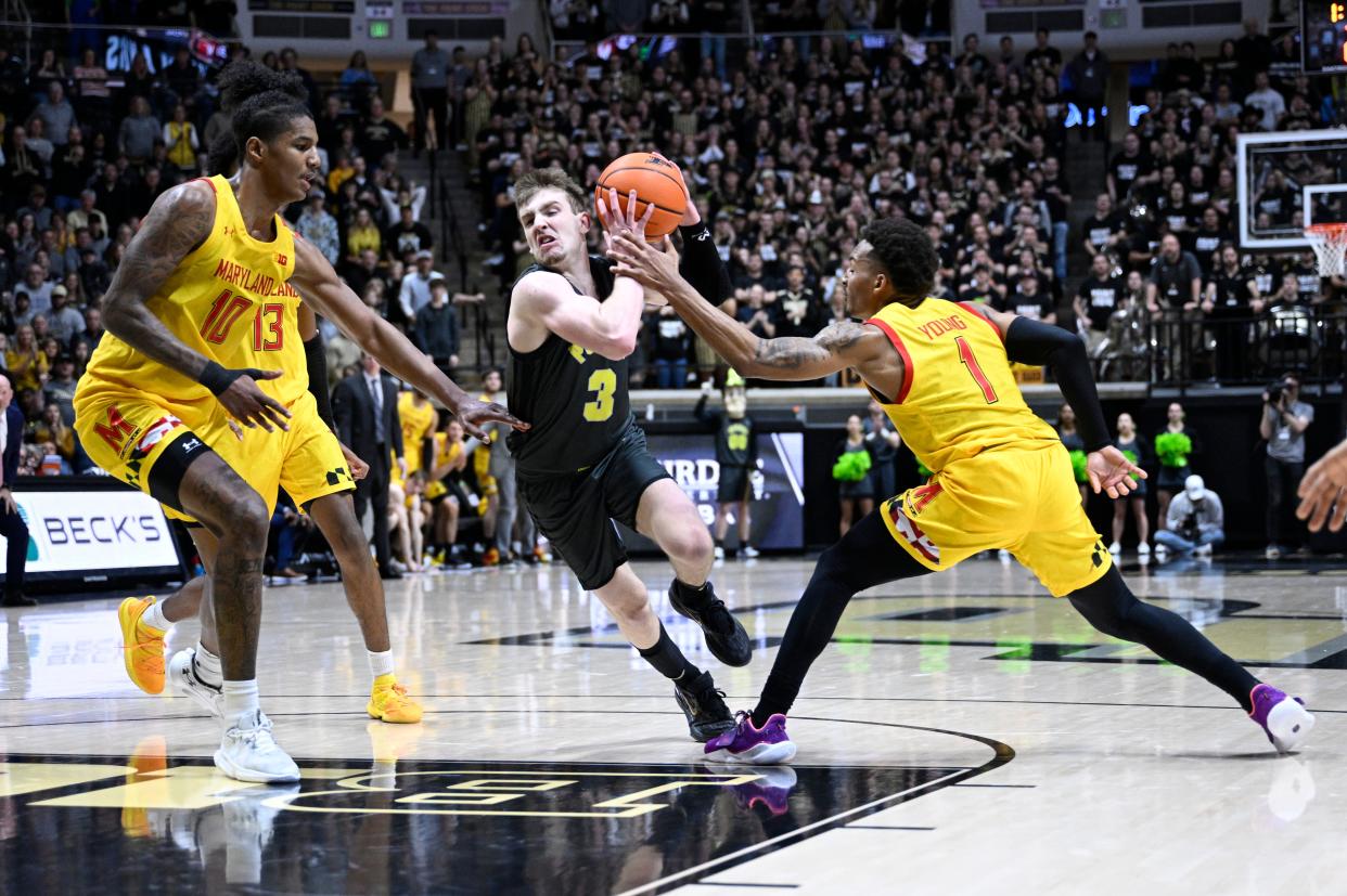 Purdue guard Braden Smith (3)  drives past Maryland guard Jahmir Young (1) on his way to the basket during the second half of their game at Mackey Arena.