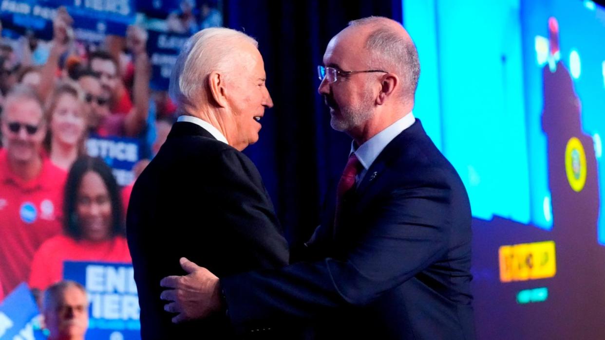 PHOTO: President Joe Biden is greeted by Shawn Fain, President of the United Auto Workers, as he arrives to speak to a United Auto Workers' political convention in in Washington D.C., Jan. 24, 2024. (Alex Brandon/AP)