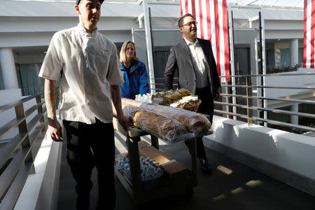 Queens Borough President Melinda Katz and Brad Blumenfeld, Vice President of Blumenfeld Development Group, deliver free lunch to Transportation Security Administration (TSA) employees working without pay during the partial government shutdown at the TSA offices inside the Bulova Corporate Center in the Queens borough of New York City, New York, U.S., January 22, 2019. REUTERS/Mike Segar