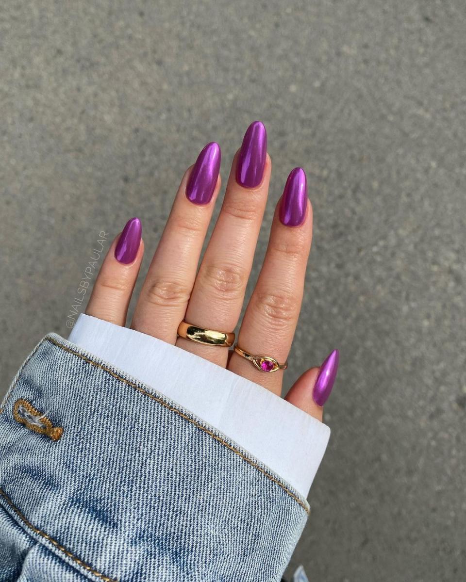 We're calling it now: This purple chrome mani is the fall-friendly evolution of <a href="https://www.glamour.com/gallery/barbie-nails?mbid=synd_yahoo_rss" rel="nofollow noopener" target="_blank" data-ylk="slk:Barbie nails;elm:context_link;itc:0;sec:content-canvas" class="link ">Barbie nails</a>.