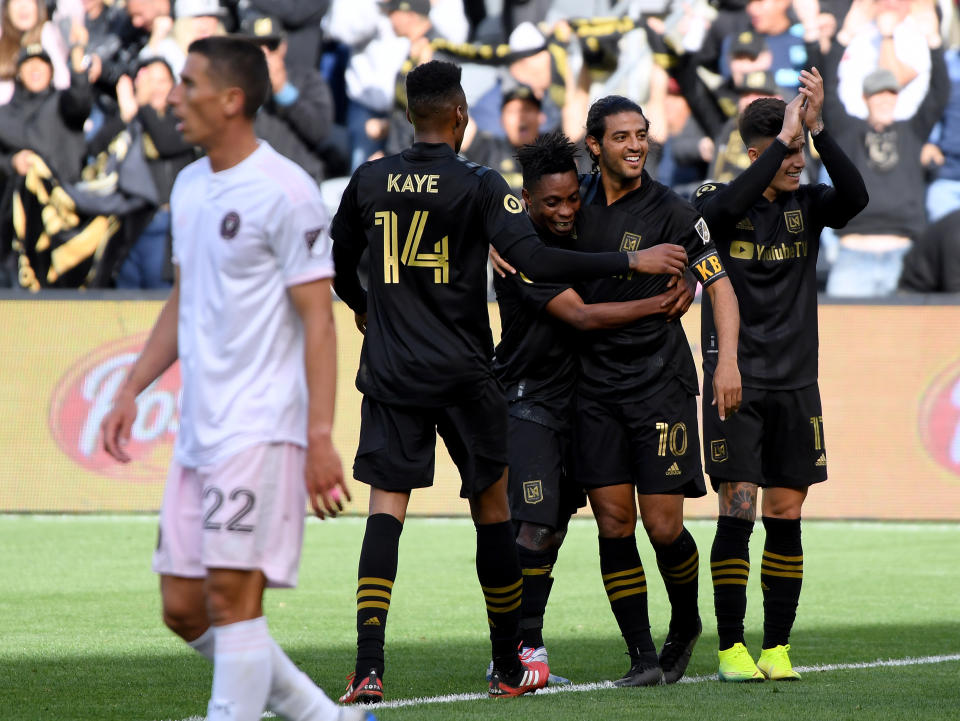 Carlos Vela (10) celebrates with his LAFC teammates after scoring the only goal in a win over Inter Miami on Sunday. (Photo by Harry How/Getty Images)