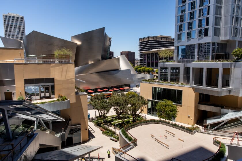 Los Angeles, CA - June 20: The Grand LA, designed by Frank Gehry and developed by Rick Vogel, executive vice president at Related, is located across from the Walt Disney Concert Hall - also deisgned by Gehry,and was intended to be a shopping, dining and entertainment complex, with one tower of luxury esidential properties and another tower for the Conrad Los Angeles, a luxury hotel from the Hilton brand, photographed in downtown Los Angeles, CA, Monday, June 20, 2022. (Jay L. Clendenin / Los Angeles Times)