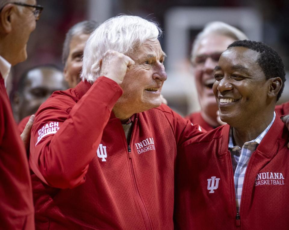 Bobby Knight, left, stands next to former Indiana player Isaiah Thomas.